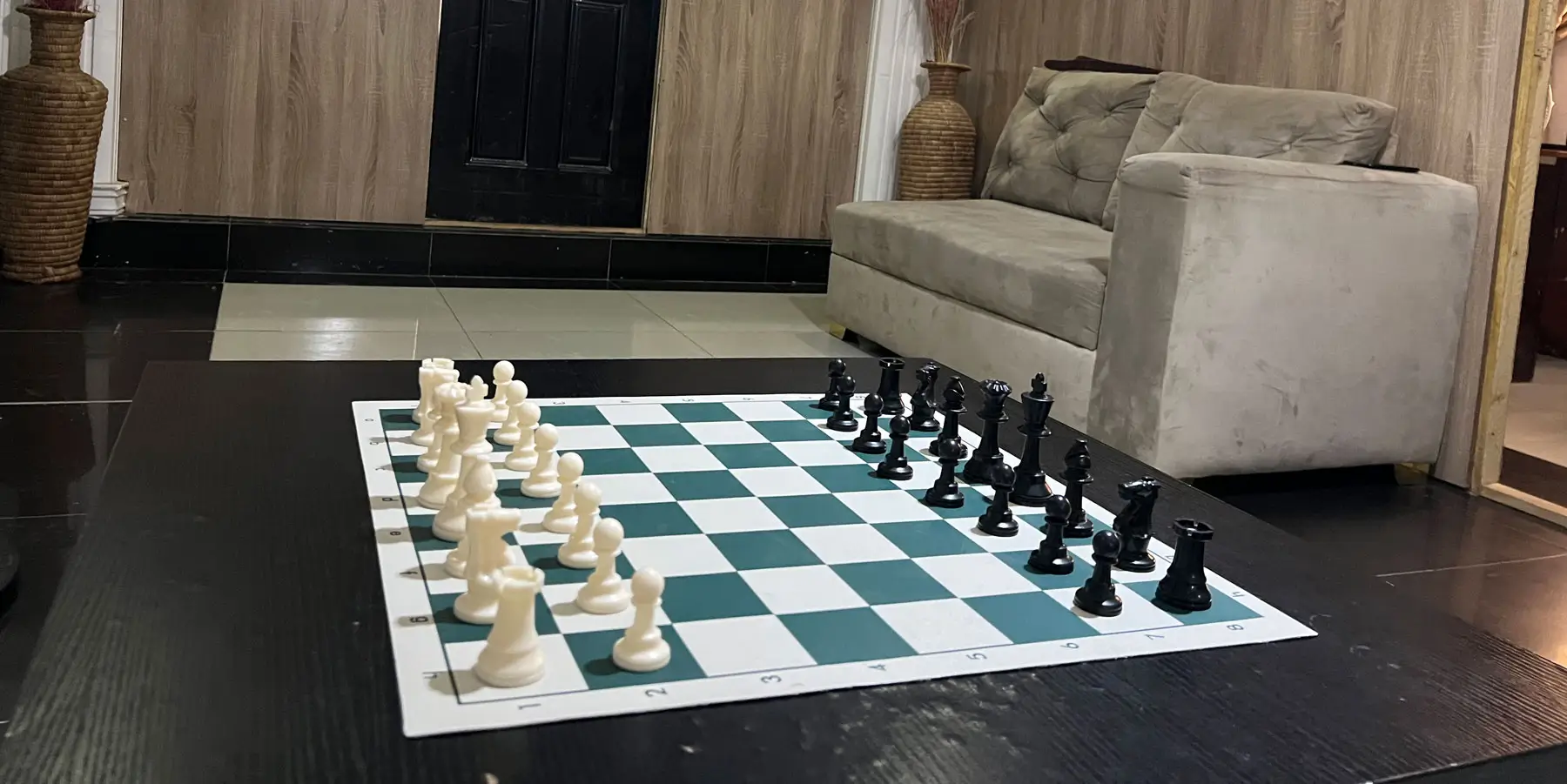 The communal lounge at Rahama Wellness Center, Abuja, with a chess set laid out on the table